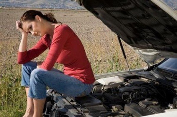 frustrated girl on her car