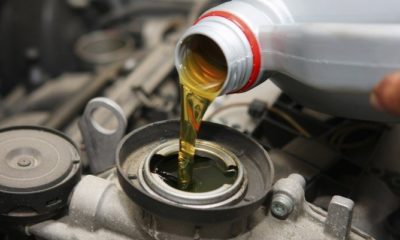 engine oil being poured into a car engine