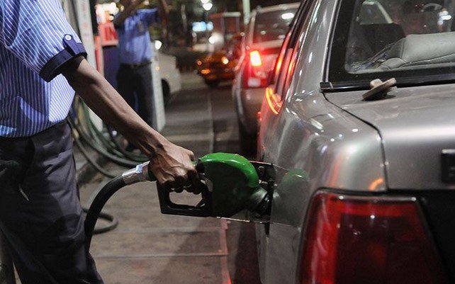 car being filled in a gas station