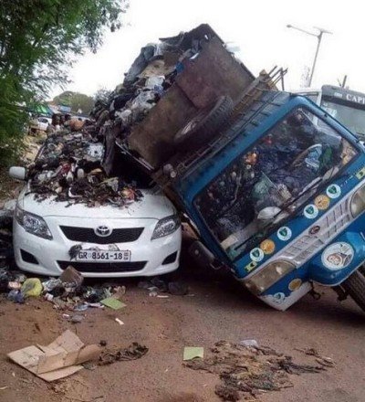 car engulfed in dirt 