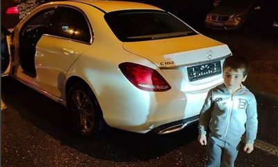 5-year-old boy poses with the mercedes Benz gifted him
