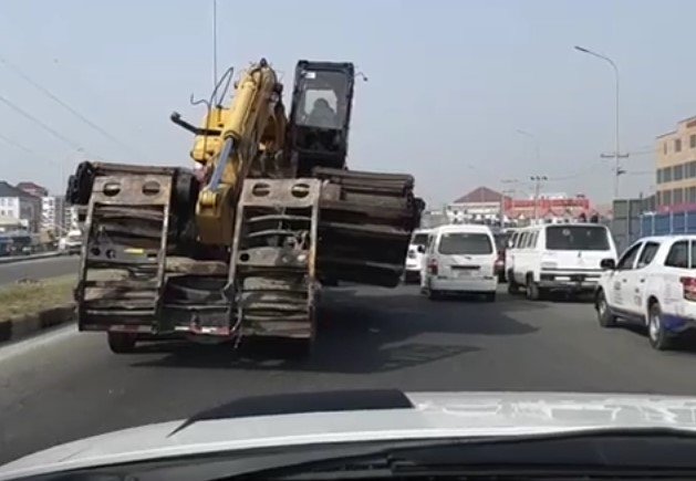 bulldozer hauled truck dangerous