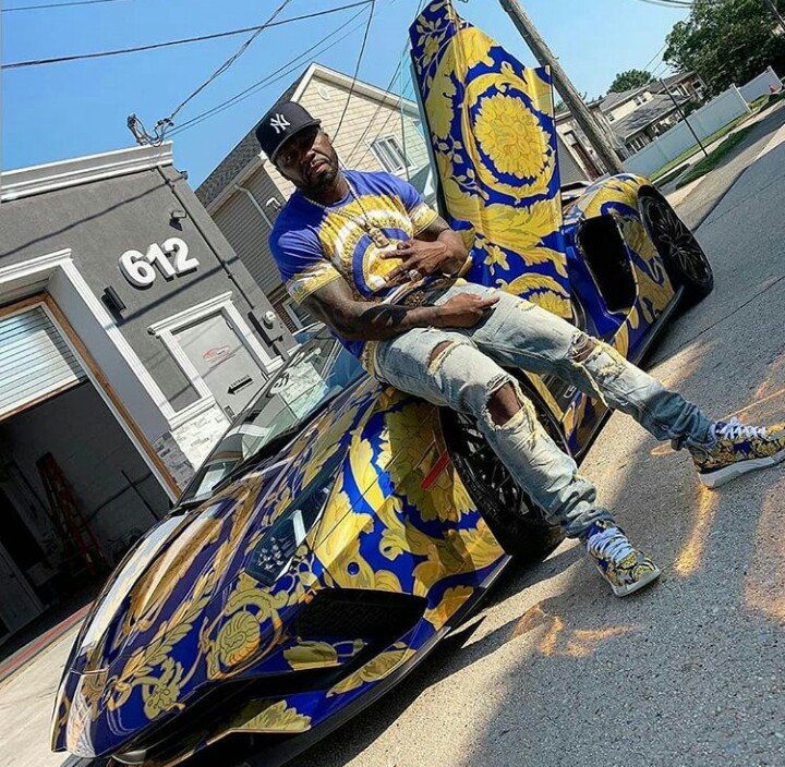 American Rapper 50cent, Poses With His Versace-Wrapped Lamborghini Aventado...
