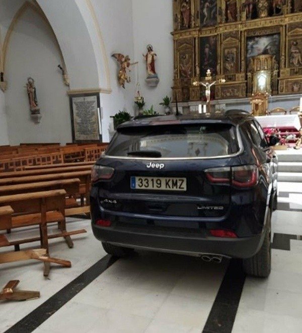 spanish-man-drives-jeep-compass-car-into-church