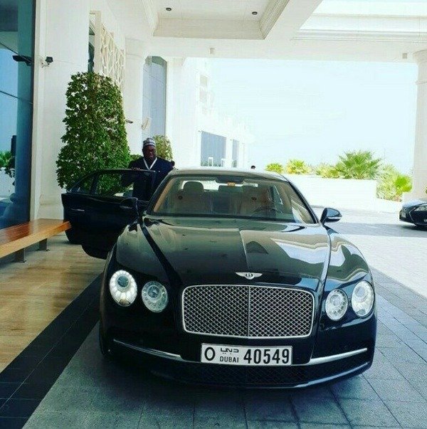 dele-momodu-is-60-today-take-a-look-at-a-rare-picture-of-him-posing-with-a-bentley-and-range-rover-cars