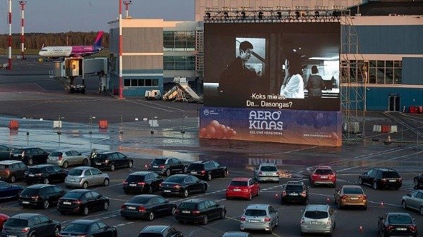 dozens-of-cars-showed-up-to-watch-movie-as-lithuania-turns-vilnius-airport-into-drive-in-cinema