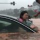 police-breaks-car-window-to-rescue-woman-stranded-in-flood