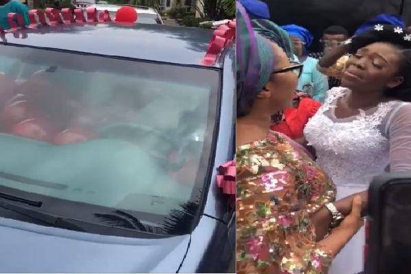 Image of A Lady named Titi who was presented a car gift on her wedding day