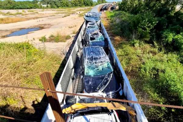 brand-new-cars-destroyed-after-ford-train-crashes-bridge