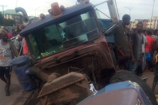 Truck Crushes Tricycle, Kills A man, Injure Others In Onitsha (PHOTOS)