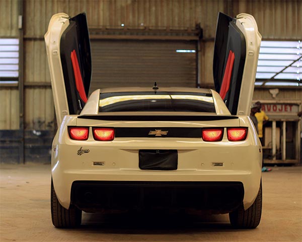 Kaduna Based Arewa Garage Pimps Chevrolet Camaro With Lamborghini Doors And Diamond Stitched Red Leather Interior 