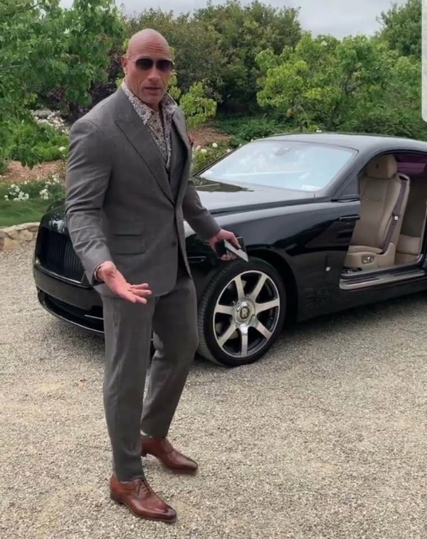 Dwayne 'The Rock' Johnson Can't Fit In A Porsche Taycan - autojosh