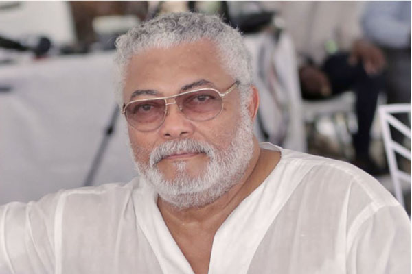 Former Ghanaian President Jerry Rawlings controlling traffic.