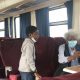 Professor Wole Soyinka Enjoys Lagos-Ibadan Train Ride, Signs Autograph For A Kid - autojosh