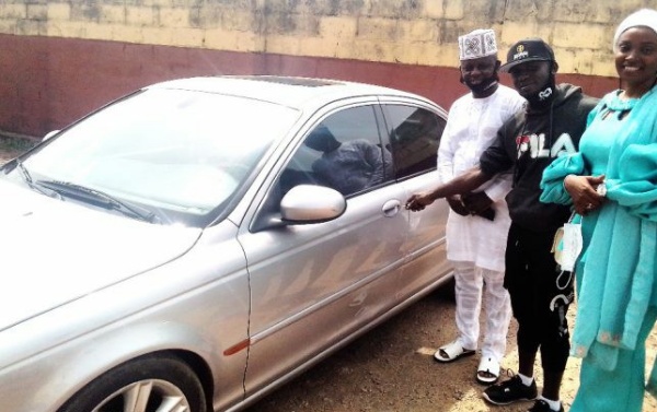 WBF Super Featherweight Champ Ridwan Oyekola Gets Car Gift From Diehard Fan - autojosh 