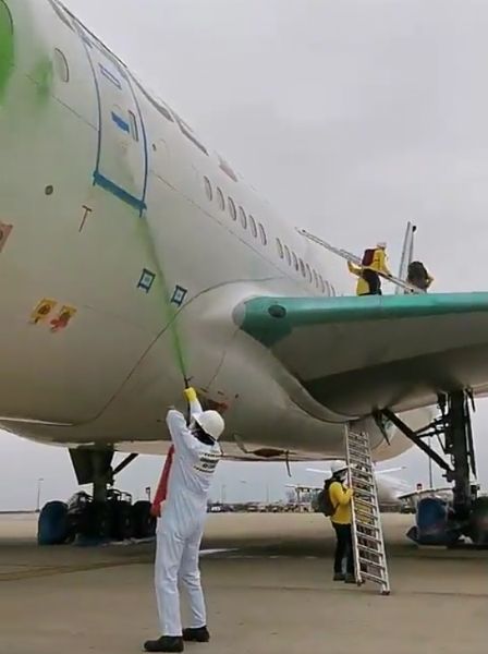 Breaking: Protesters Vandalize Air France 777 Aircraft With Green Paints At Paris Airport - autojosh