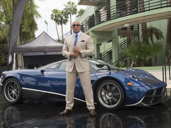 Dwayne 'The Rock' Johnson Can't Fit In A Porsche Taycan - autojosh