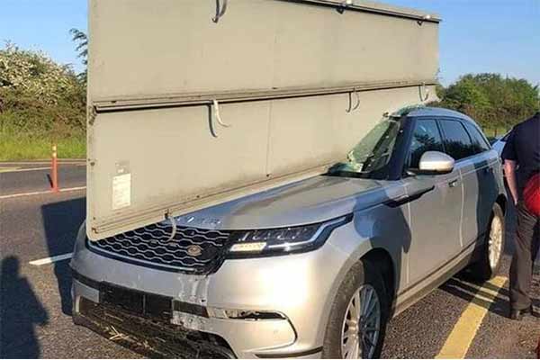 UK Driver Escapes Death After Crashing Range Rover Into Road Sign, Slicing Through Through The SUV - autojosh