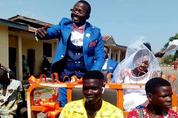 Ekiti OAP Shares Wedding Pictures, Rides In Tricycle Pick Up With Bride To Reception