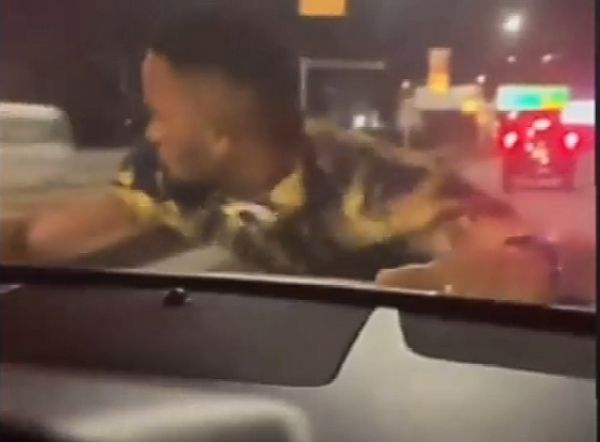 Watch : Man Clings To Speeding Car After Female Driver Refused To Tip Him For Parking On His “Territory” - autojosh 