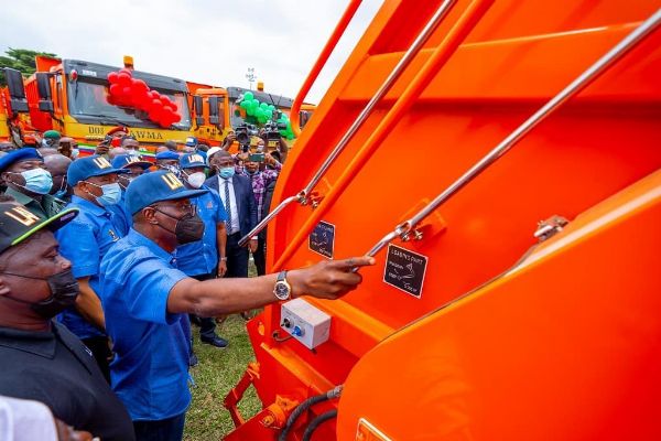 Gov. Sanwo-Olu Unveils 102 Brand New Compactor Trucks & 100 Double Dino Trucks For LAWMA - autojosh 