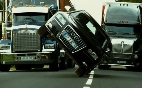 Transporter 3 Audi A8 Drove On Two Wheels Between Two Trucks During A 