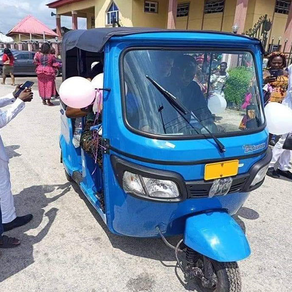 Mixed Reactions Trail Nigerian Comedian, Anointed Aboki, As He Rides In Style With Bride To Church In A Tricycle (PHOTOS) - autojosh 