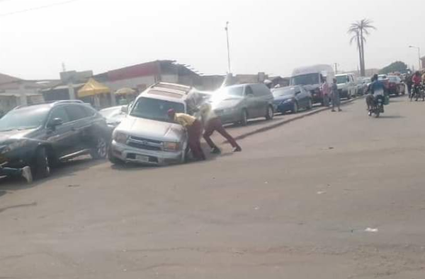 Today's Photo : LASTMA Officers Helping A Motorist To Pull Out The Front Tyre Of His SUV Stuck In A Ditch - autojosh 