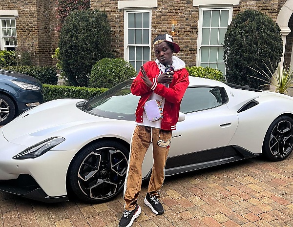 Portable In London : Singer Gets  Cash Gift From Pastor Tobi, Poses  With His Rolls-Royce, Lamborghini, Maserati