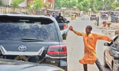 Today's Photo : Gov. Zulum Of Borno State Shakes Hands With A Kid As His Convoy Rides Through The City - autojosh