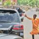 Today's Photo : Gov. Zulum Of Borno State Shakes Hands With A Kid As His Convoy Rides Through The City - autojosh