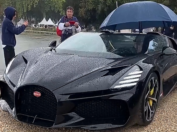 Driver Uses Umbrella After Roofless $5M Bugatti Mistral Was Caught In Rain During European Launch - autojosh 