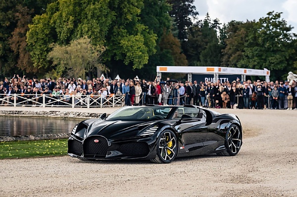 Driver Uses Umbrella After Roofless $5M Bugatti Mistral Was Caught In Rain During European Launch - autojosh