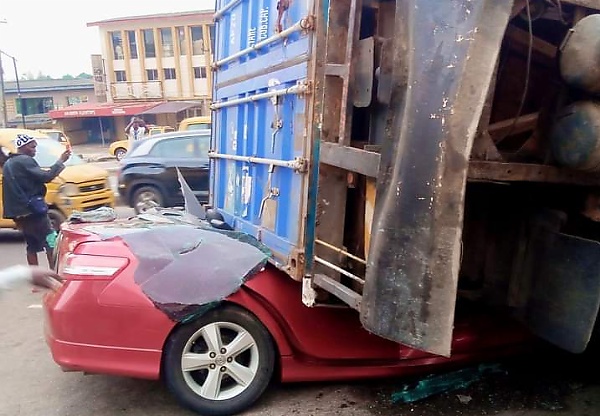 No Casualty As 20ft Container Crushes Toyota Camry In Lagos - autojosh