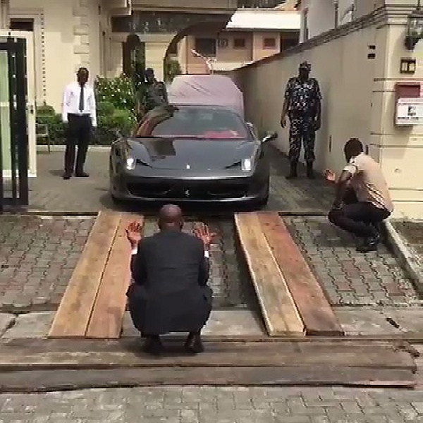 Watch As Nigerian Billionaire Struggle To Drive His Ferrari Through Makeshift Wooden Ramp - autojosh 