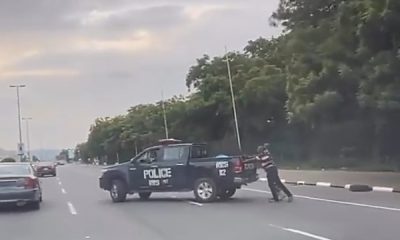 Officials Of Nigerian Police Seen Pushing Their Broken Down Operational Vehicle - autojosh
