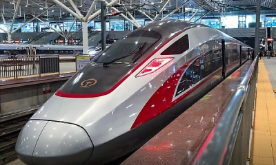 Moment A High-speed Bullet Train Overtakes A Regular Train In China - autojosh