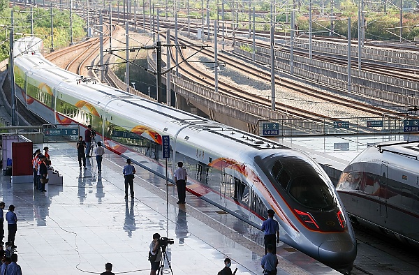 Moment A High-speed Bullet Train Overtakes A Regular Train In China - autojosh 