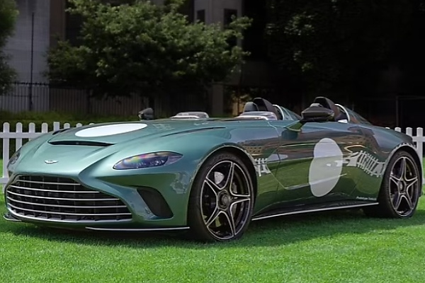 Rain Forces Owner To Use Three Umbrellas To Cover The Interior Of Roofless $1Million Aston Martin - autojosh 