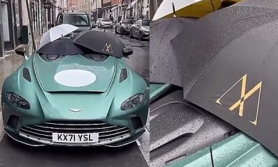 Rain Forces Owner To Use Three Umbrellas To Cover The Interior Of Roofless $1Million Aston Martin - autojosh