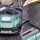 Rain Forces Owner To Use Three Umbrellas To Cover The Interior Of Roofless $1Million Aston Martin - autojosh