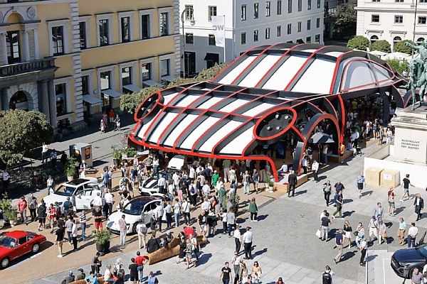 Porsche Displays Its Cars Inside An Oversized Porsche 911 Stand At 2023 IAA Auto Show - autojosh