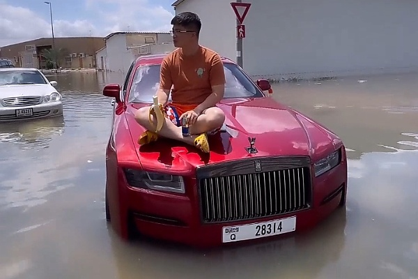 Stranded Man Sits On The Bonnet Of His Rolls-Royce Ghost Worth N800m Caught In Dubai Flood - autojosh