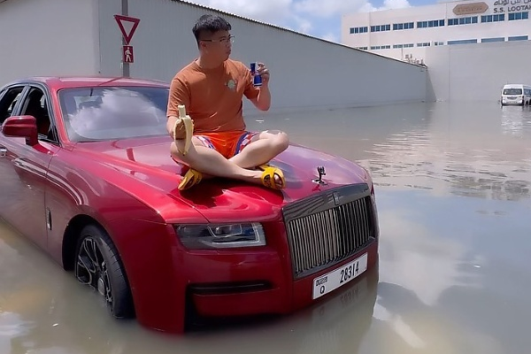 Stranded Man Sits On The Bonnet Of His Rolls-Royce Ghost Worth N800m Caught In Dubai Flood - autojosh 