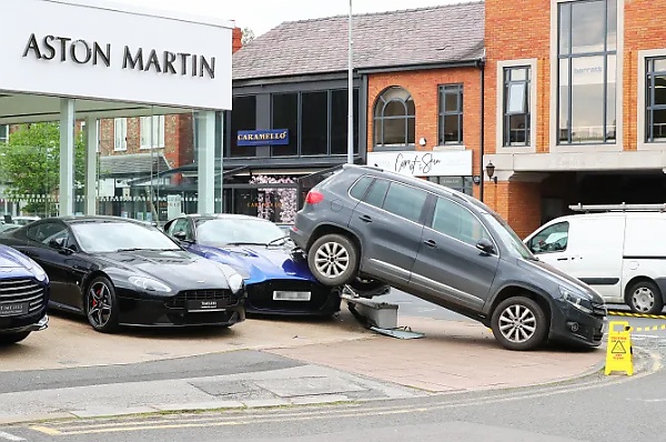 VW Driver Reverses £10,000 Tiguan Over A £210,000 Aston Martin DBS Supercar At A Dealership - autojosh 