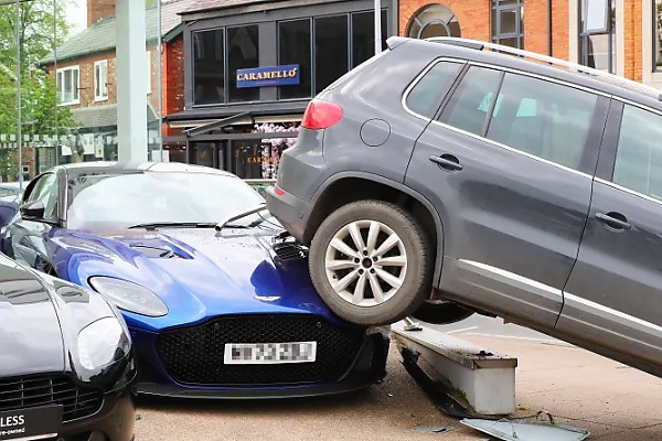 VW Driver Reverses £10,000 Tiguan Over A £210,000 Aston Martin DBS Supercar At A Dealership - autojosh 