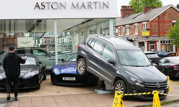 VW Driver Reverses £10,000 Tiguan Over A £210,000 Aston Martin DBS Supercar At A Dealership - autojosh