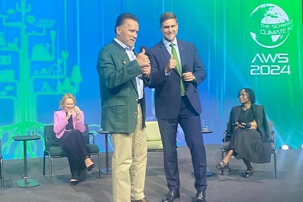 Climate Change Activist Arnold Schwarzenegger Poses With Eco-friendly All-electric BMW i7 At The AWS24 - autojosh 