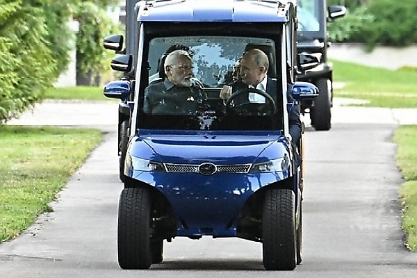 Russian President Vladimir Putin Drives Indian PM Modi Around In Electric Golf Cart