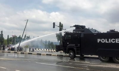 Protest : Moment Police Armored Water Cannon Truck Rammed Into NSCDC Truck, Injuring An Officer - autojosh